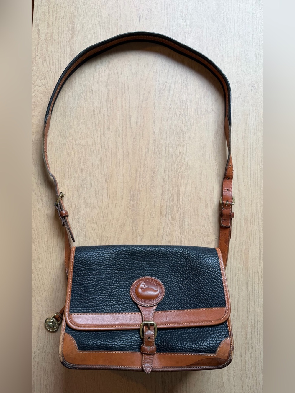 Dooney & Bourke Black Pebbled Leather Crossbody with Brown Trim